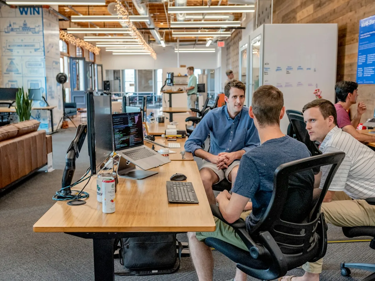 Business professionals collaborating with computers