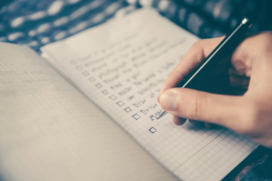 Writing a content plan in a notebook