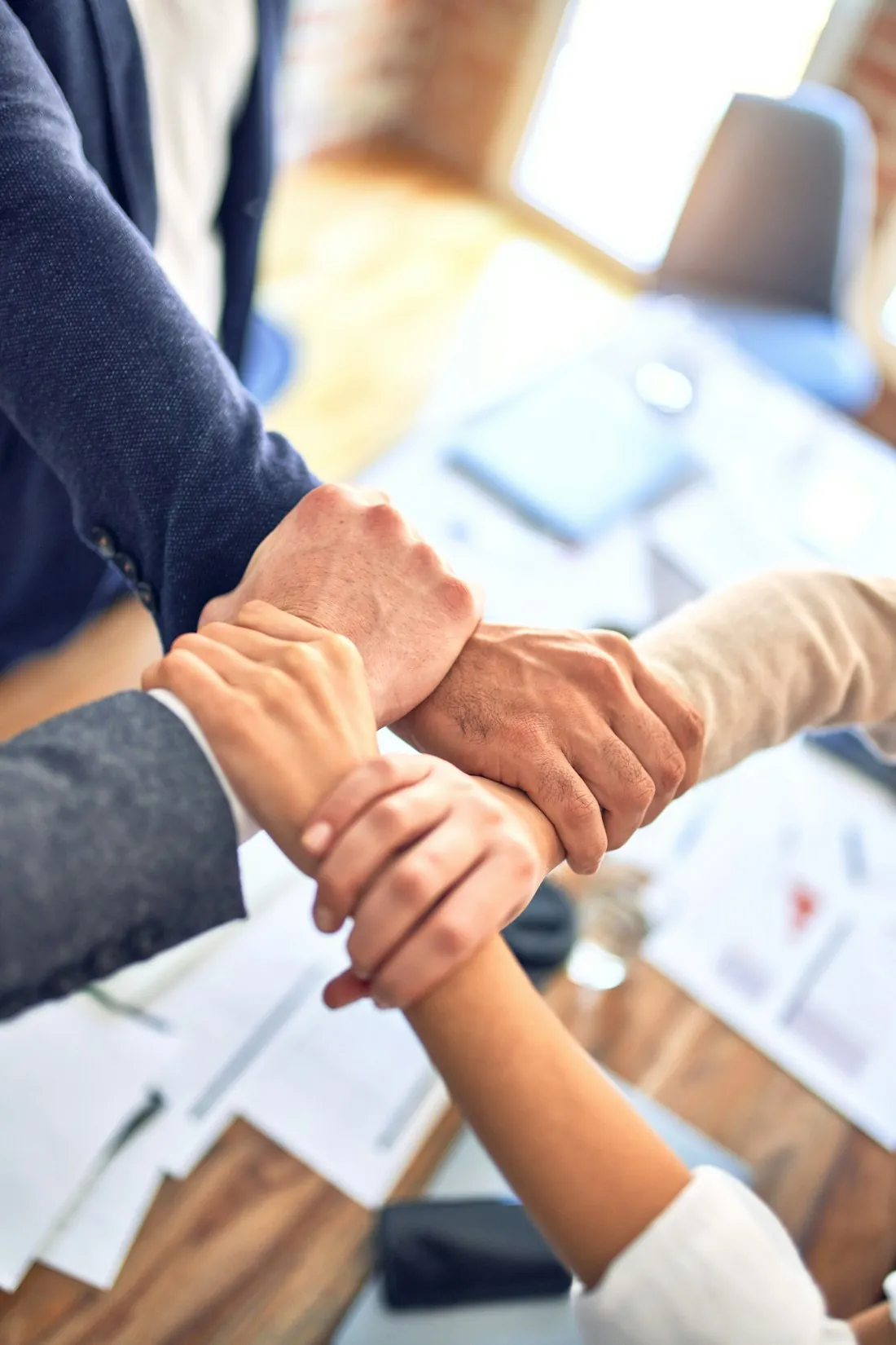 Team connecting hands in collaboration